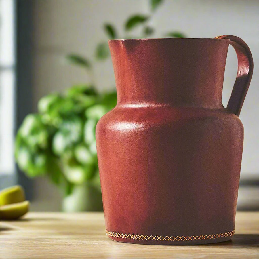 Bati | Natural Leather Carafe | Brown Leather Pitcher | Leather Cup | Leather Coaster Set | Luxury Bar Accessories | Leather Candle Handle | Leather Glass Holder | Leather Vase | Leather Tote | Leather Purse | Leather Bags